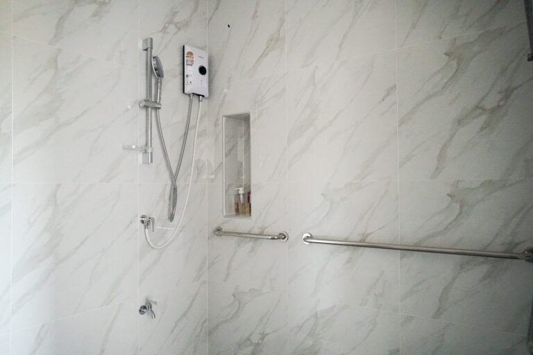 Private bathroom with handrails
